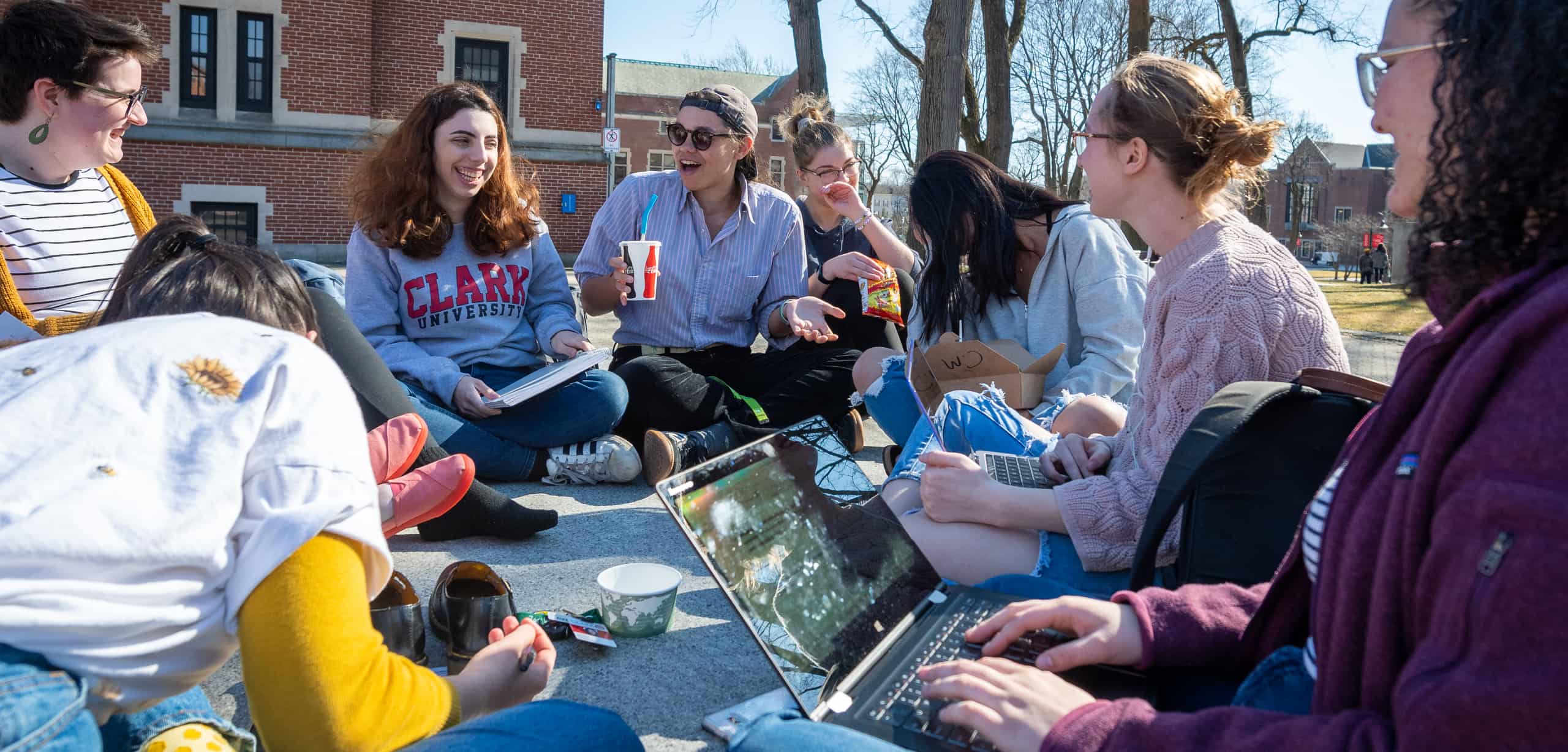 students hang out on the green